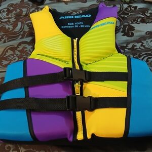 NWOT Airhead Youth Life Vest - Purple, Yellow, Blue. Item Not Used.